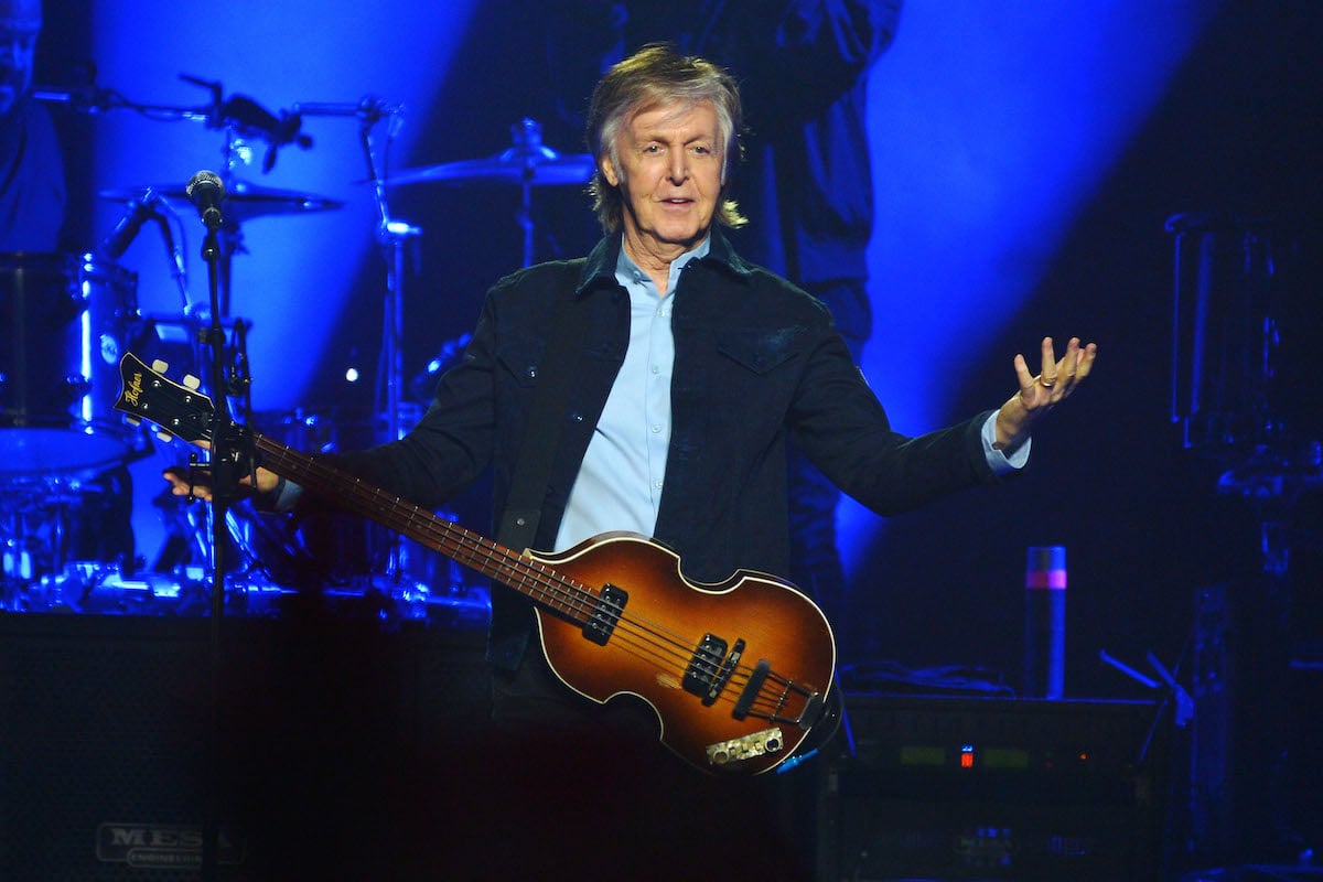 Paul McCartney performing on stage