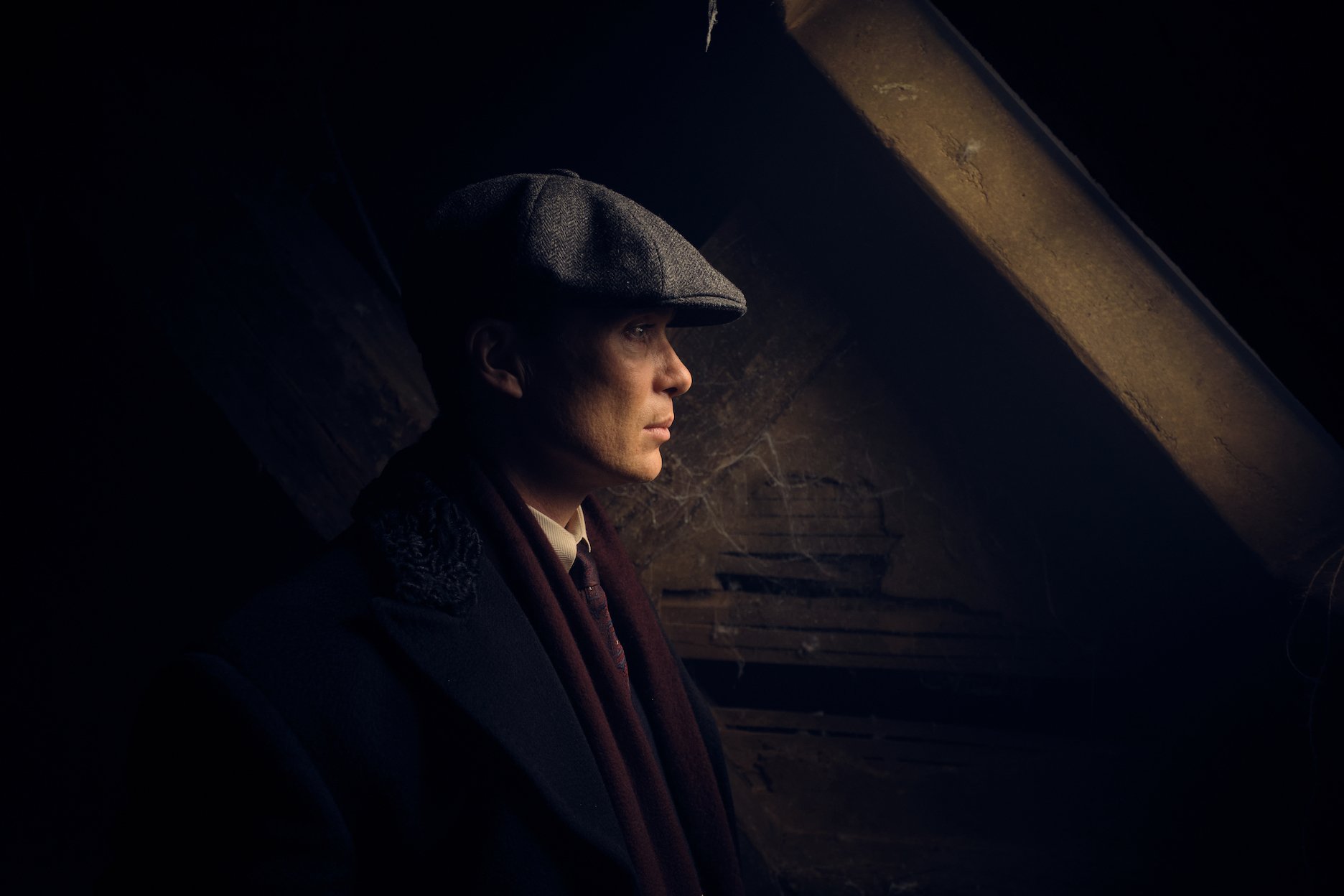 Thomas Shelby's profile as he's standing in a shadow in 'Peaky Blinders' Season 6