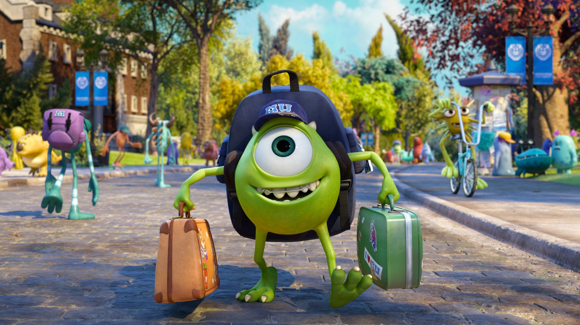 Pixar movie 'Monsters University' starring Mike Wazowski (voiced by Billy Crystal). He's holding baggage and wearing a university hat taking step into the university.