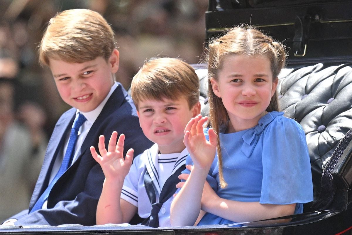 Prince George, Prince Louis, and Princess Charlotte at their Trooping the Colour carriage debut waving to crowds
