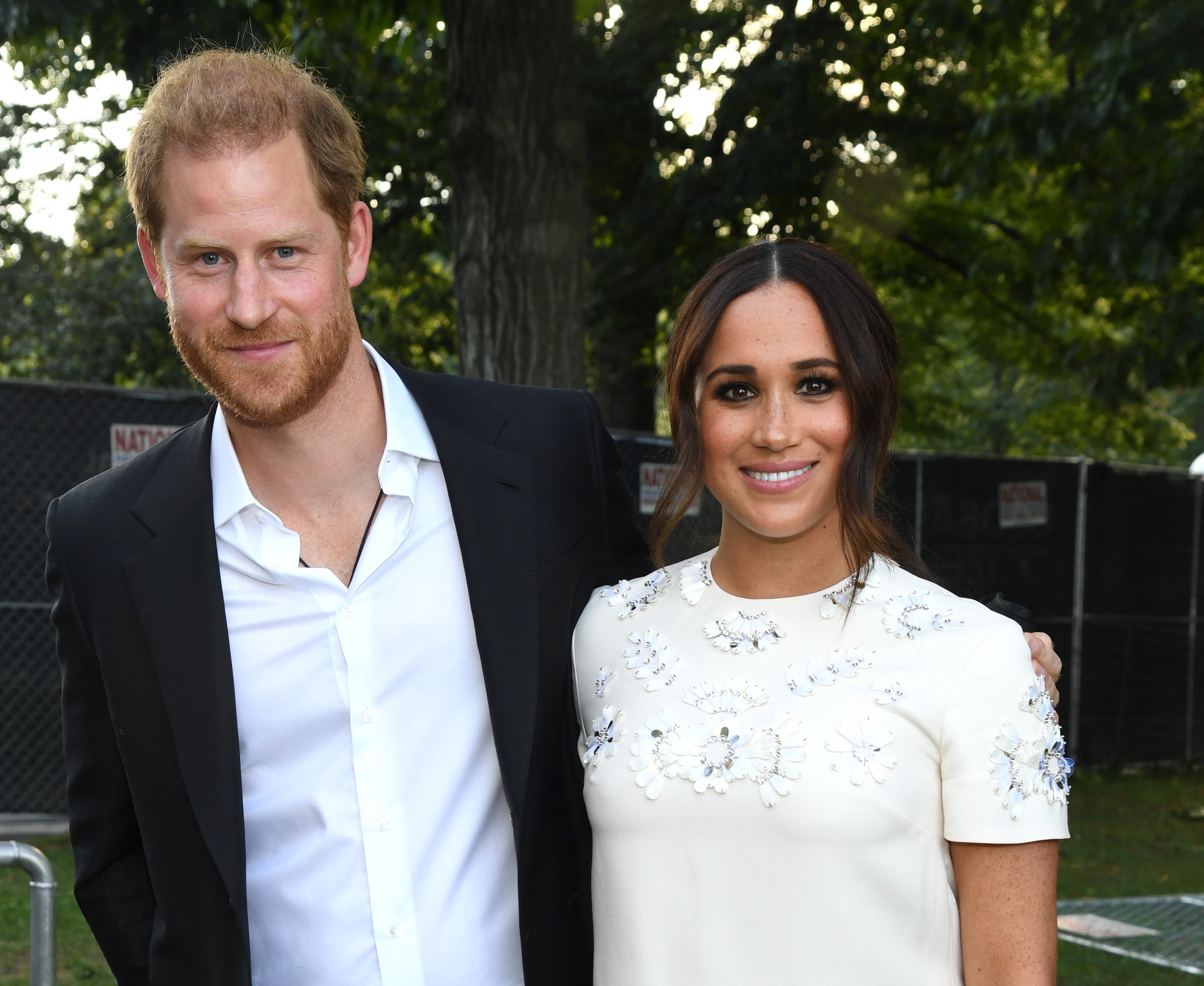 Prince Harry and Meghan Markle, who have hired a director for their Netflix reality show, pose for a photo at the New York Global Citizen Live