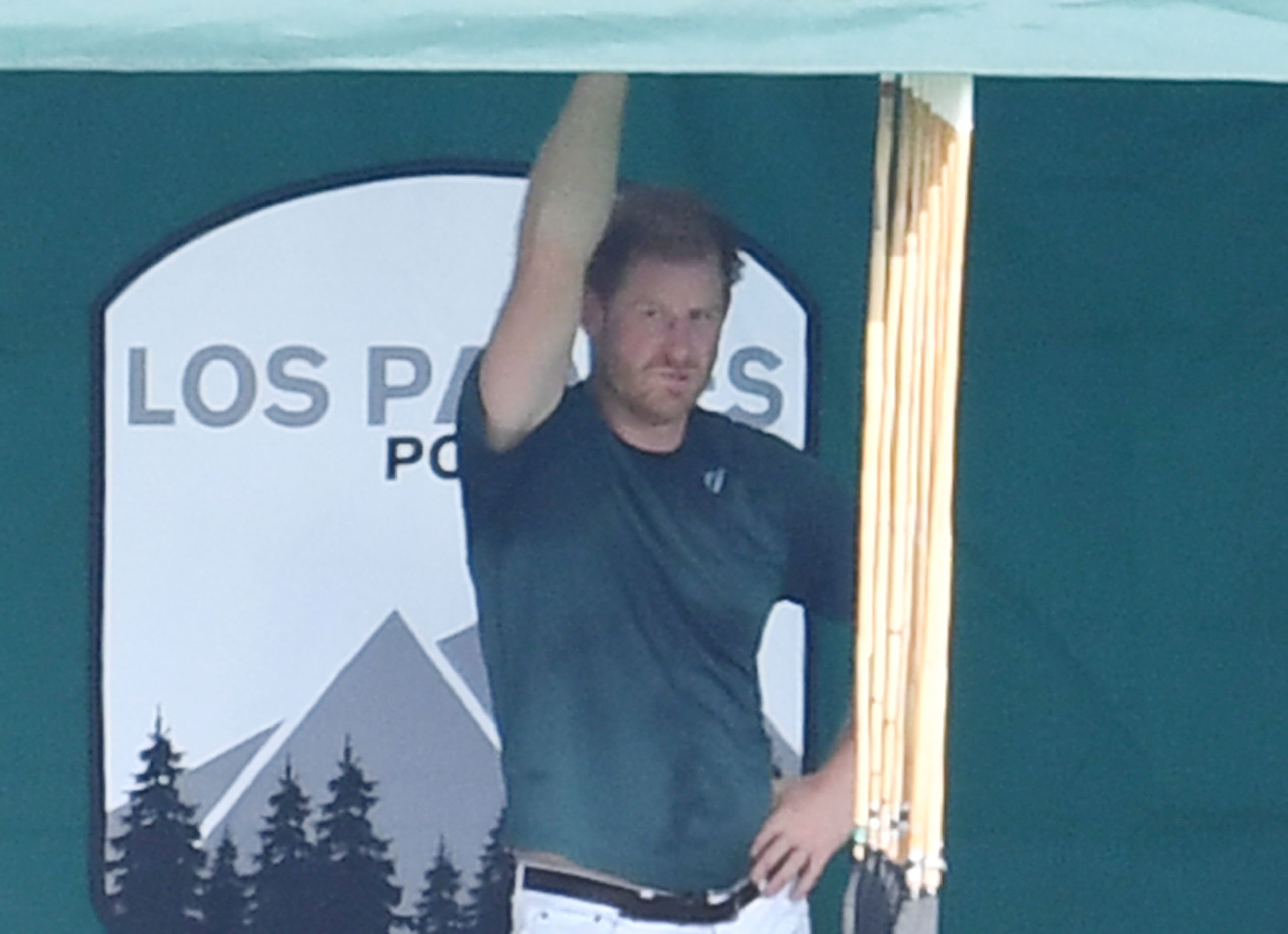 Prince Harry, who was reportedly upset with the treatment he received at the jubilee, standing at one of his polo matches in Santa Barbara, California