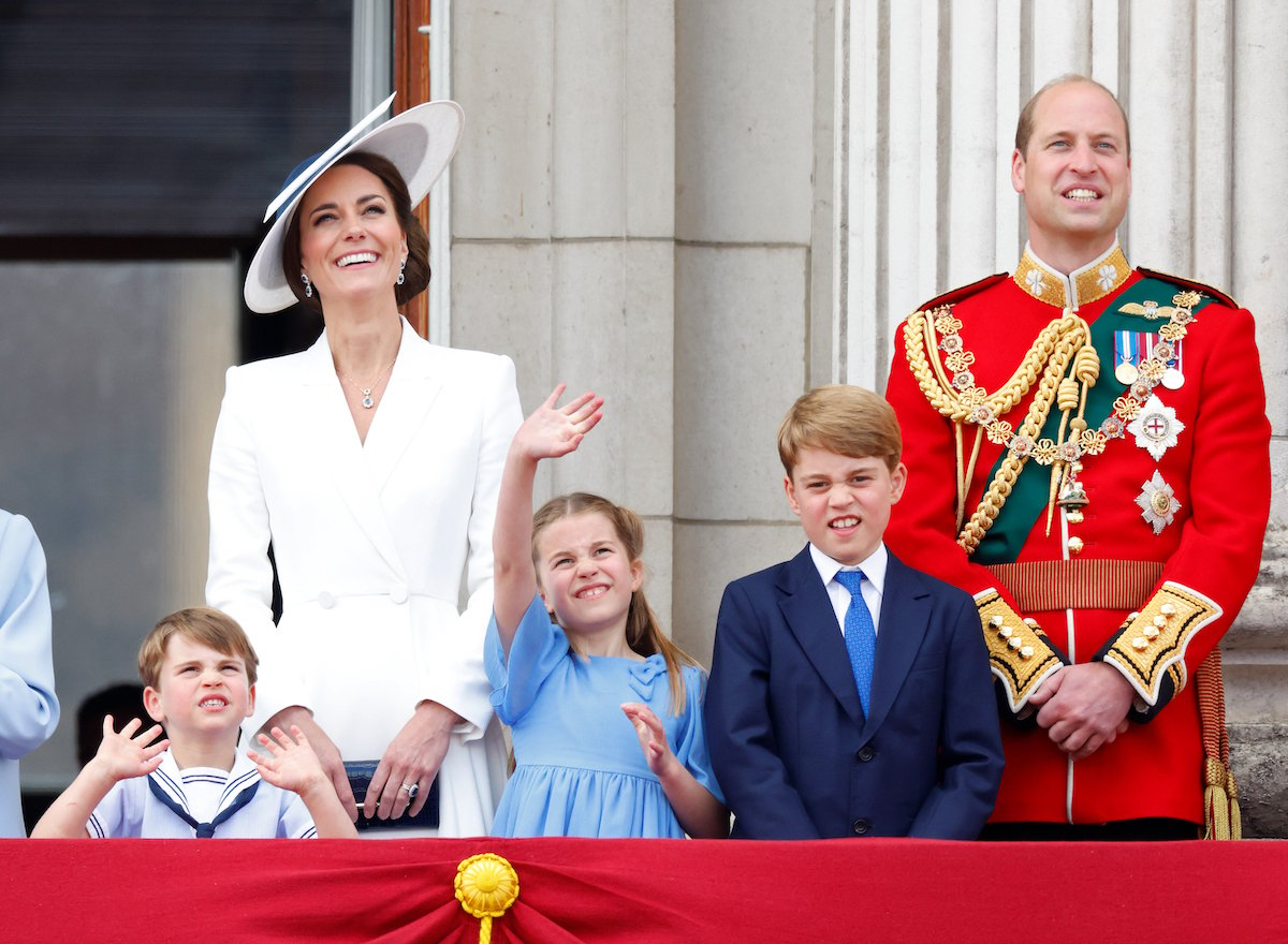 Kate Middleton and Prince William, who reacted to Prince Louis' Platinum Jubilee weekend on Instagram, stand with Prince Louis, Princess Charlotte, and Prince George on the Buckingham Palace balcony