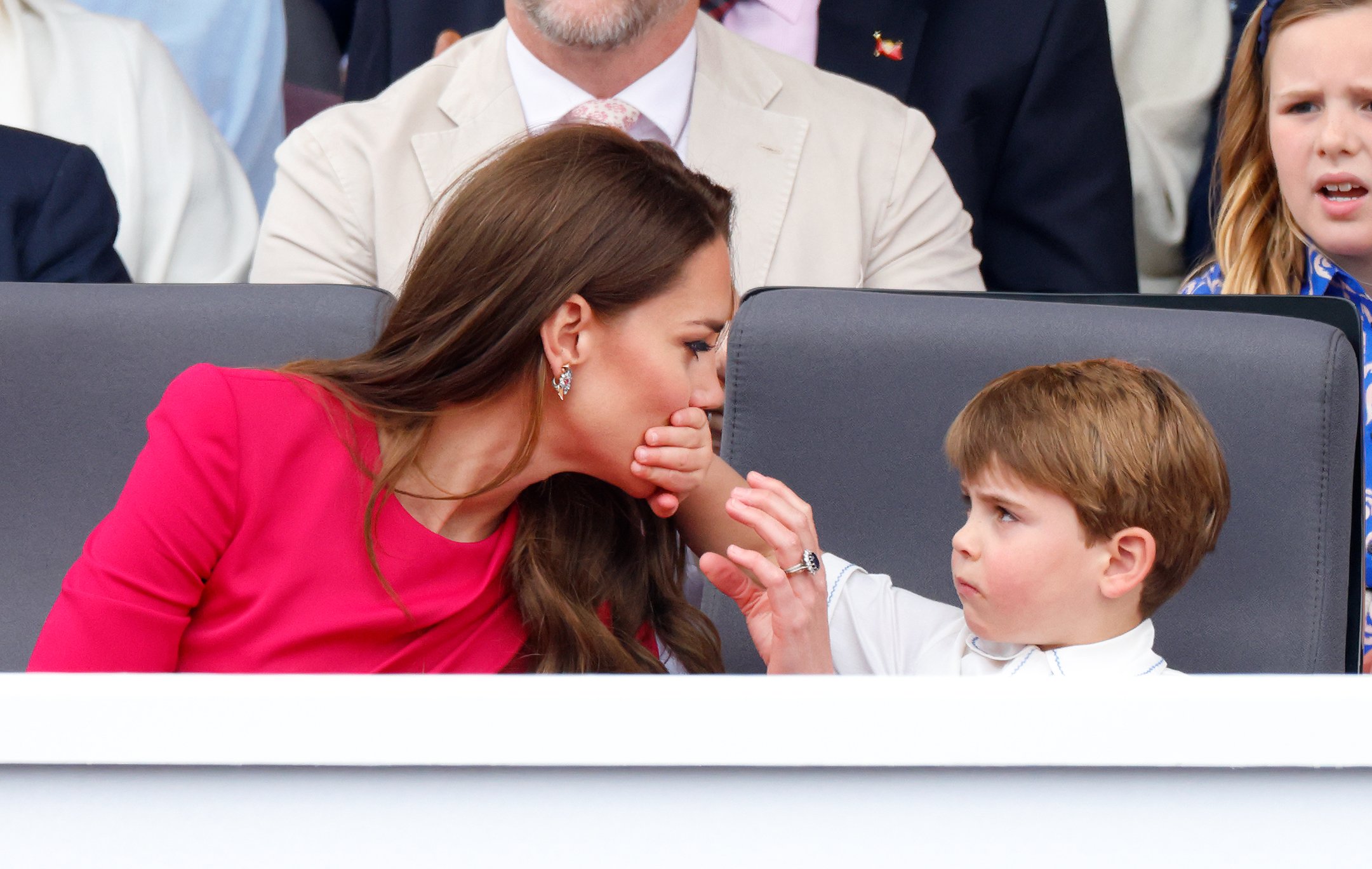 Prince Louis covers his mother Kate Middleton's mouth with his hand