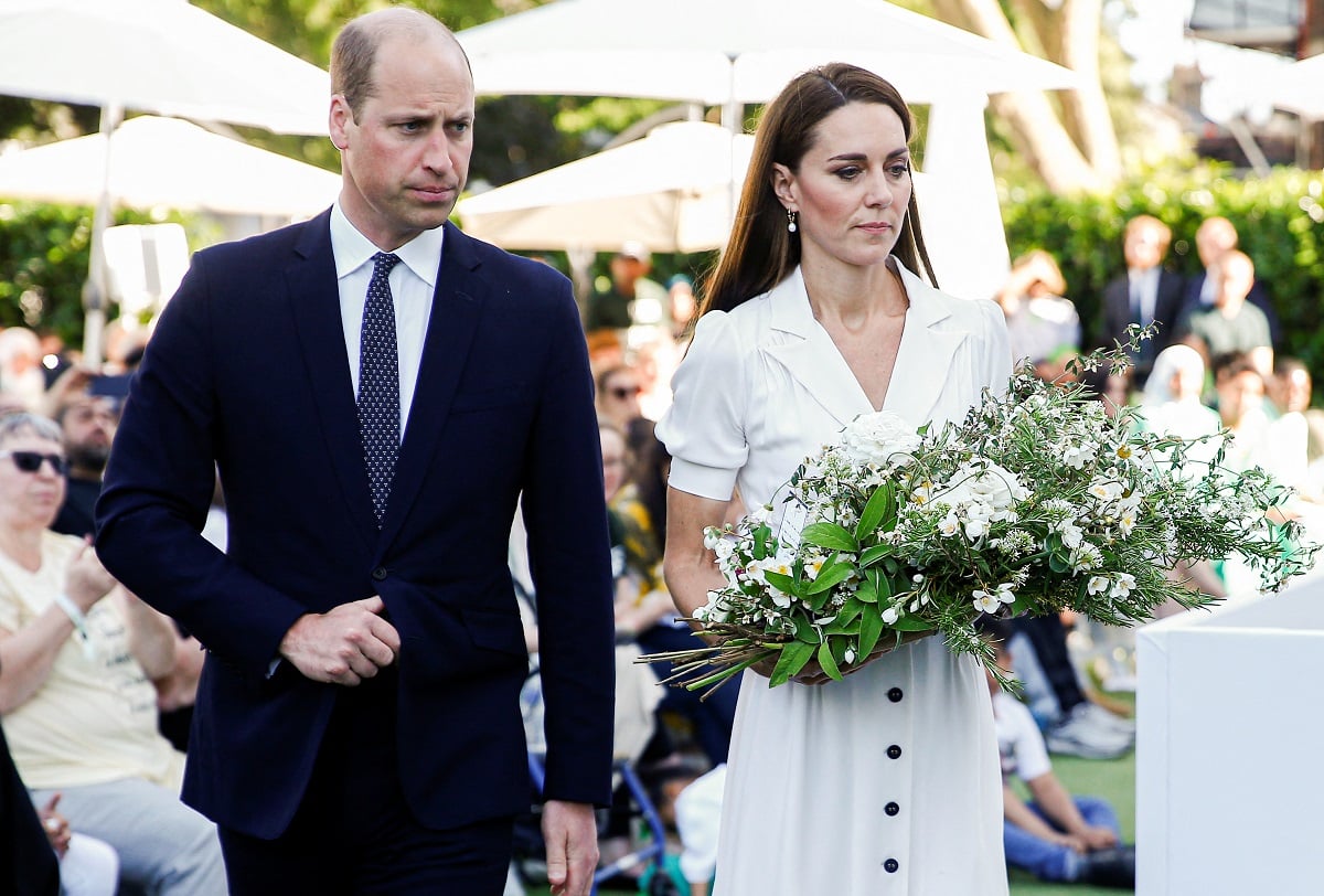 Prince William and Kate Middleton lay a wreath during a memorial service to mark anniversary of the Grenfell Tower fire