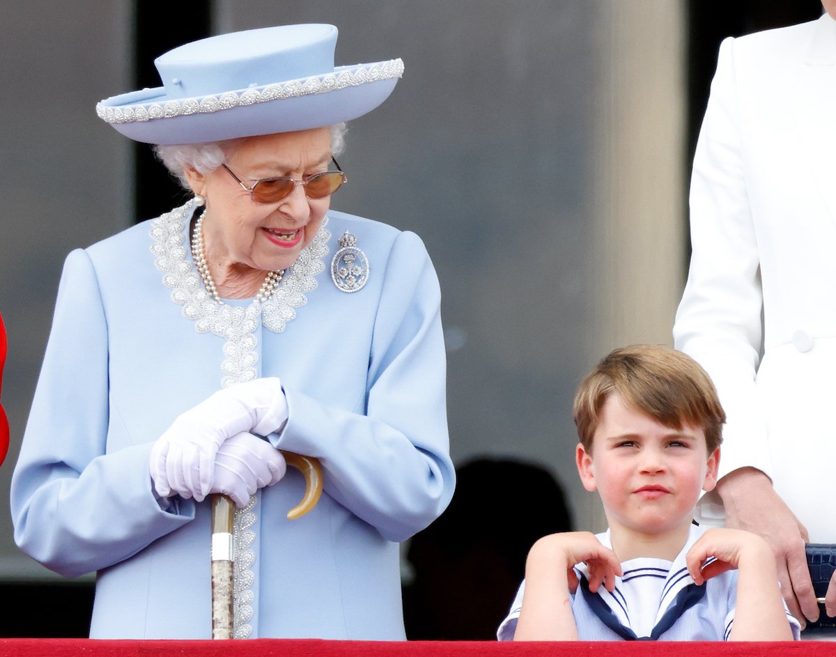 Queen Elizabeth II and Prince Louis, who asked Queen Elizabeth II a question, stand on the balcony of Buckingham Palace