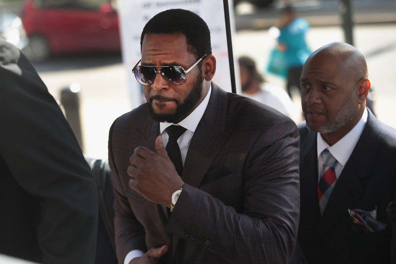 R. Kelly post a court hearing; Kelly's legal team is requesting a light sentence as more sexual abuse allegations arise