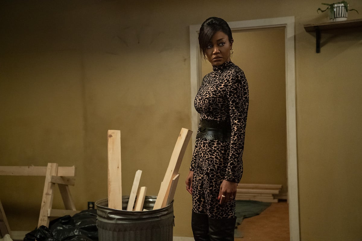 Raquel Thomas wears a leopard print body suit in the living room of one of her apartments in a scene from 'Power Book III: Raising Kanan'