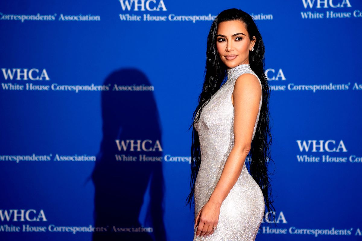 TV personality Kim Kardashian wears a silver dress on the red carpet for the White House Correspondents Association gala