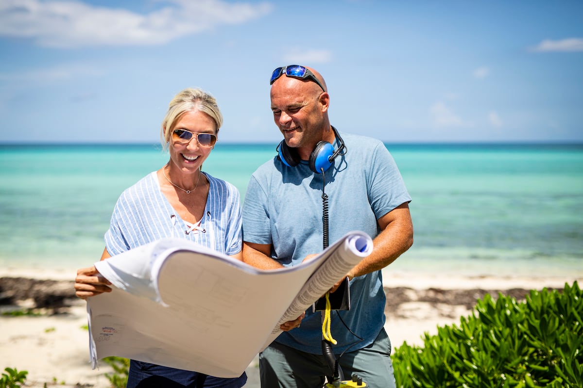 Sarah and Bryan Baeumler from 'Renovation Island' look over plans on the beach