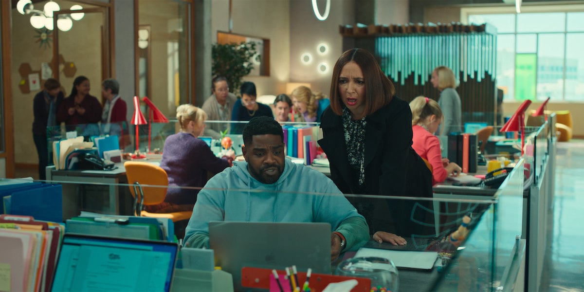 Ron Funches and Maya Rudolph look at a computer in 'Loot' Season 1 Episode 4: 'Excitement Park'