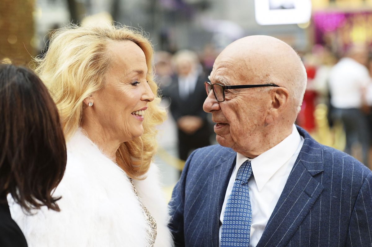 Rupert Murdoch and Jerry Hall looking at each other at an outdoor movie premiere