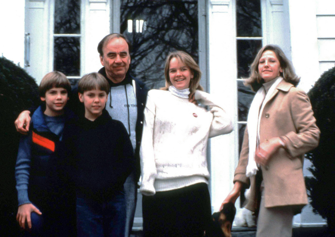 Rupert Murdoch standing with three of his kids and his wife, Anna Murdoch, outside in the '80s