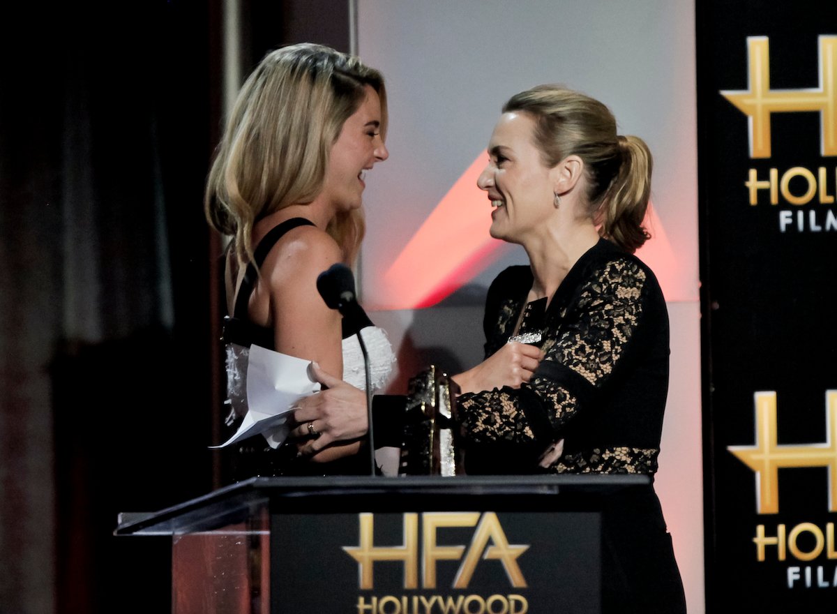 Shailene Woodley and Kate Winslet laugh on stage