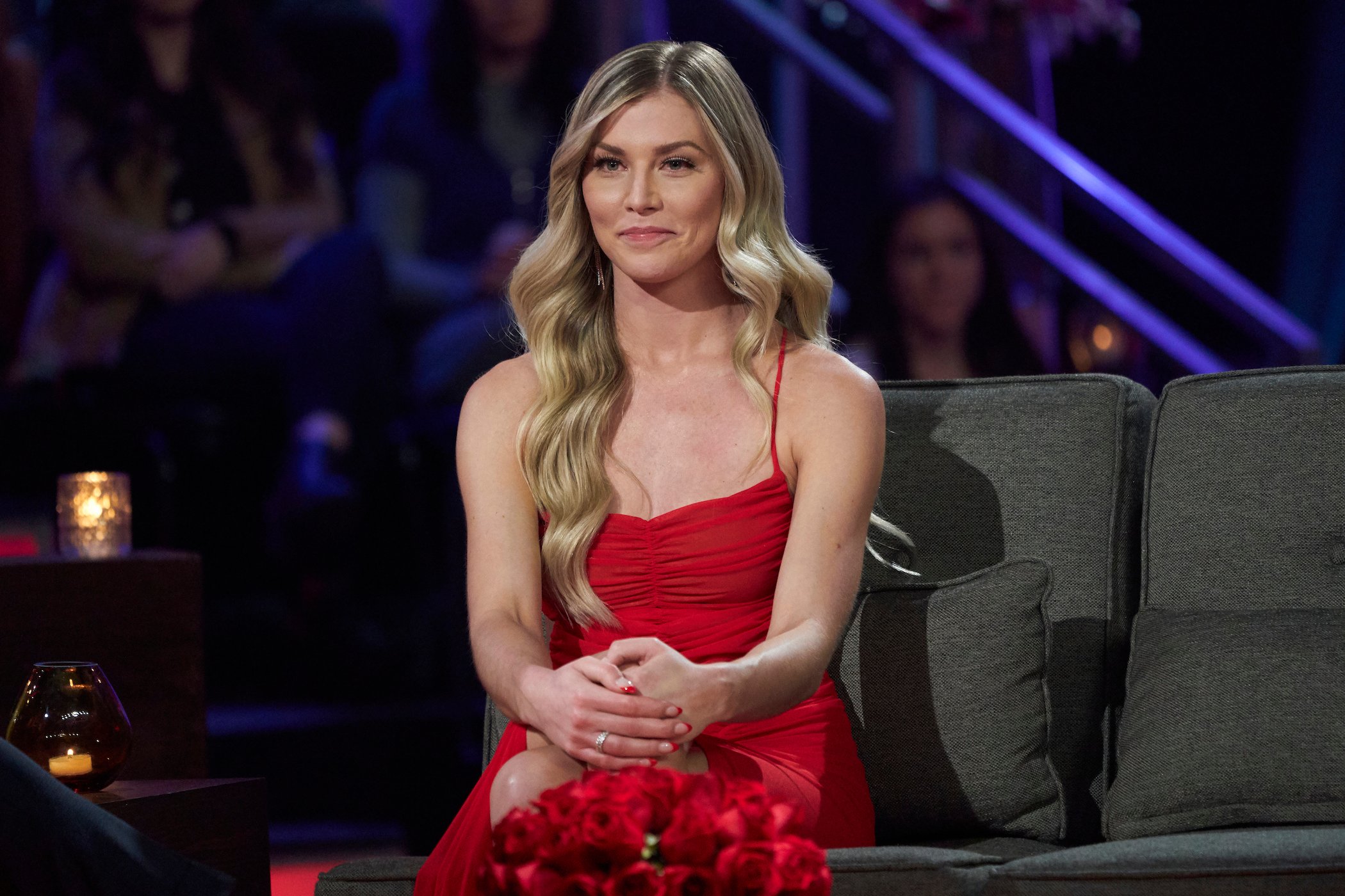 Shanae Ankney from 'The Bachelor' sitting in a red dress at the after show. She will join the 'Bachelor in Paradise' 2022 cast.
