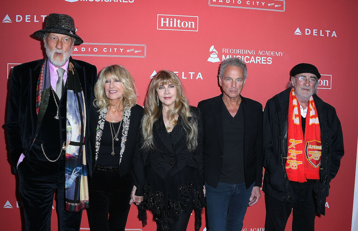Mick Fleetwood, Christine McVie, Stevie Nicks, Lindsey Buckingham, and John McVie of Fleetwood Mac pose together at an event.