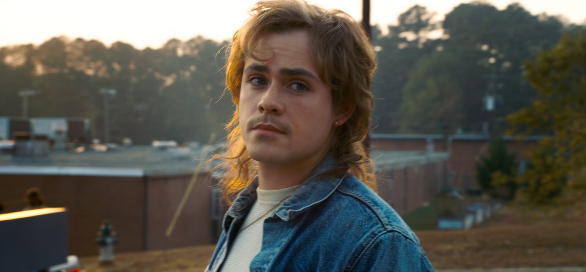 One 'Stranger Things 4' fan theory suggests Billy Hargrove, seen here in a production still from season 2 wearing a denim jacket, survived the Battle at Starcourt.