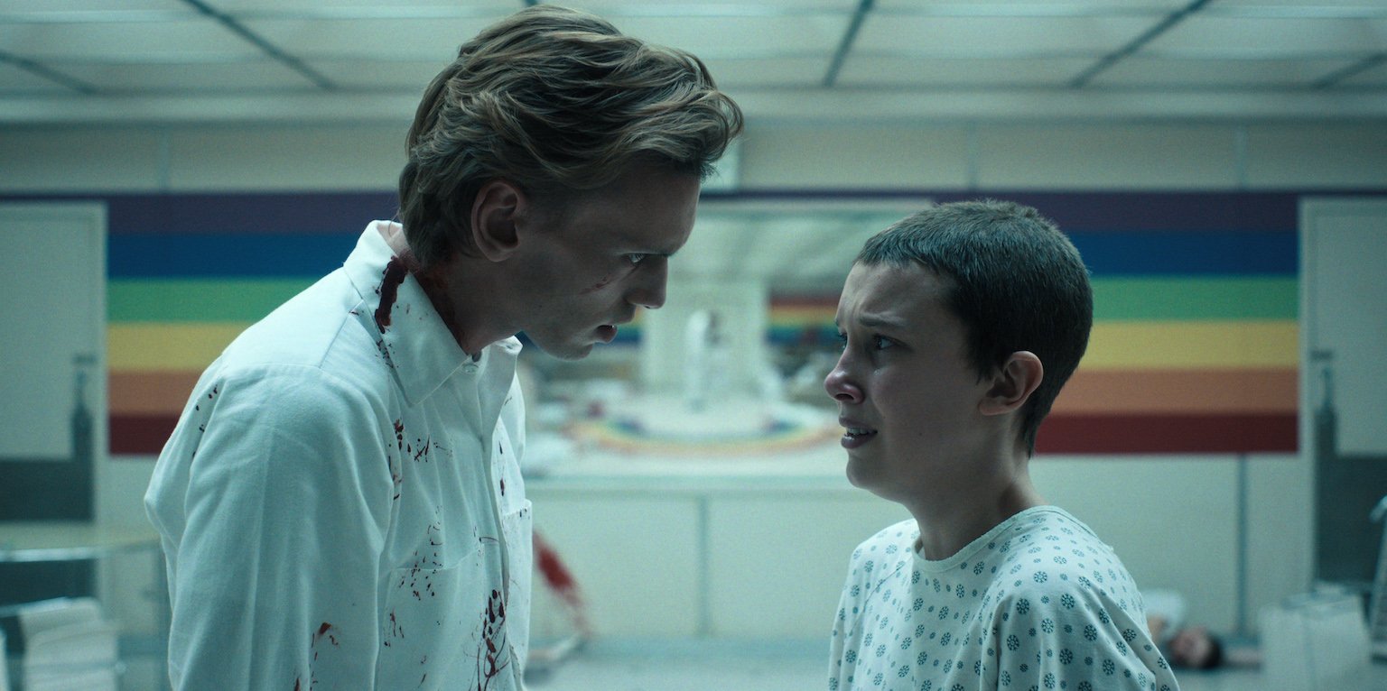 Henry covered in blood speaking to a scared Eleven in Hawkins Lab in 'Stranger Things' Season 4 Volume 1