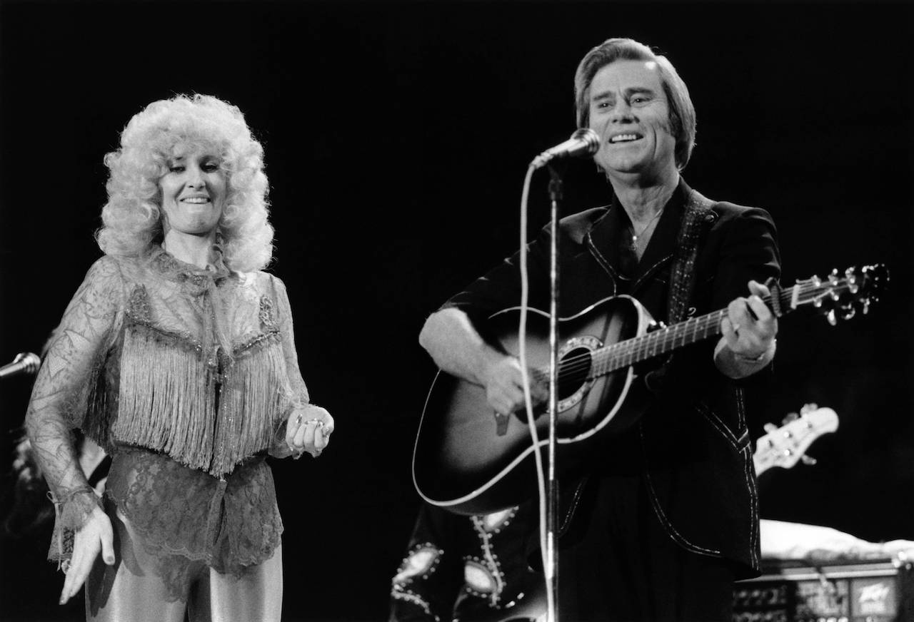 Tammy Wynette and George Jones, pictured performing in London, fell in and out of love