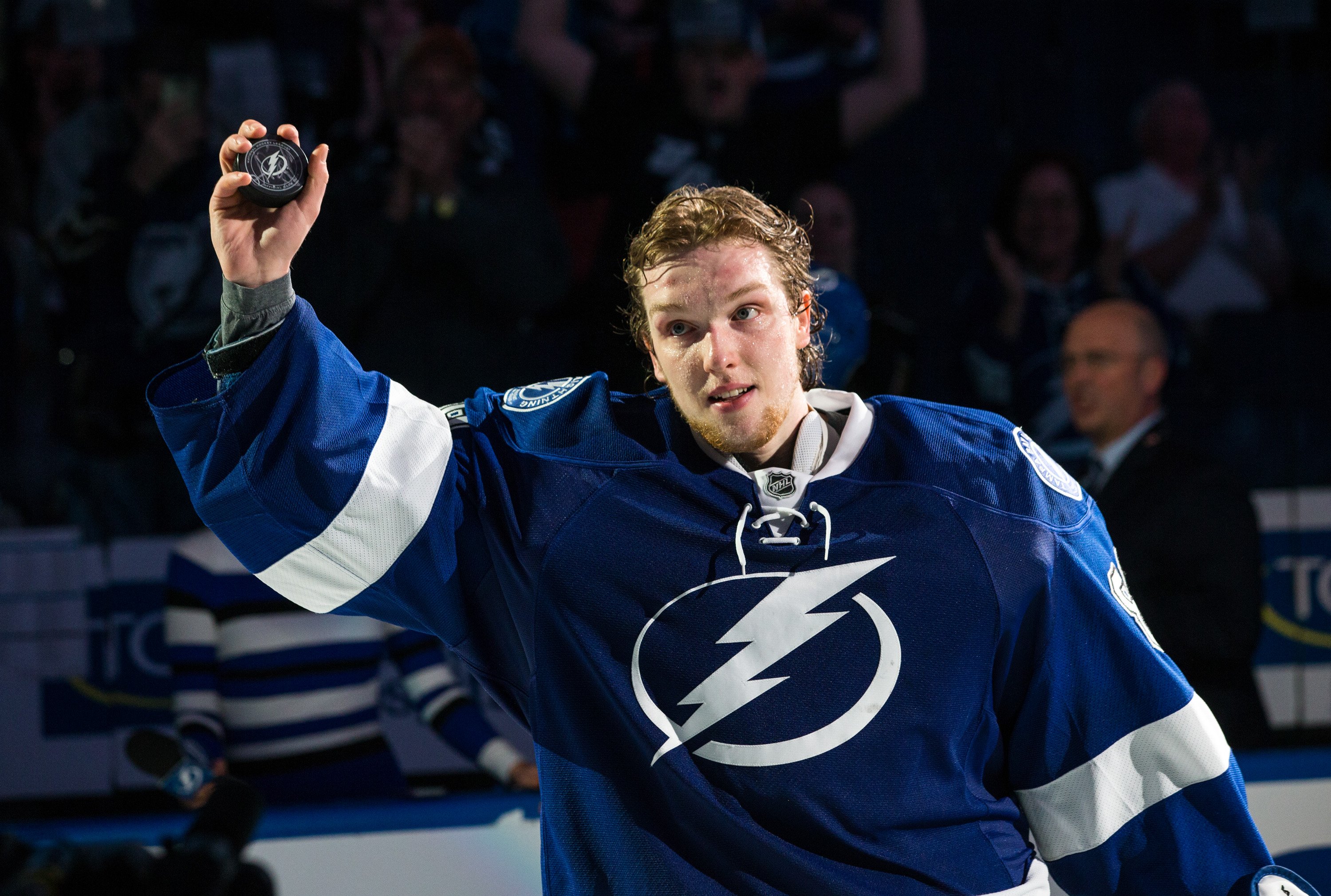 Tampa Bay Lightning goaltender Andrei Vasilevskiy holding up a hockey puck