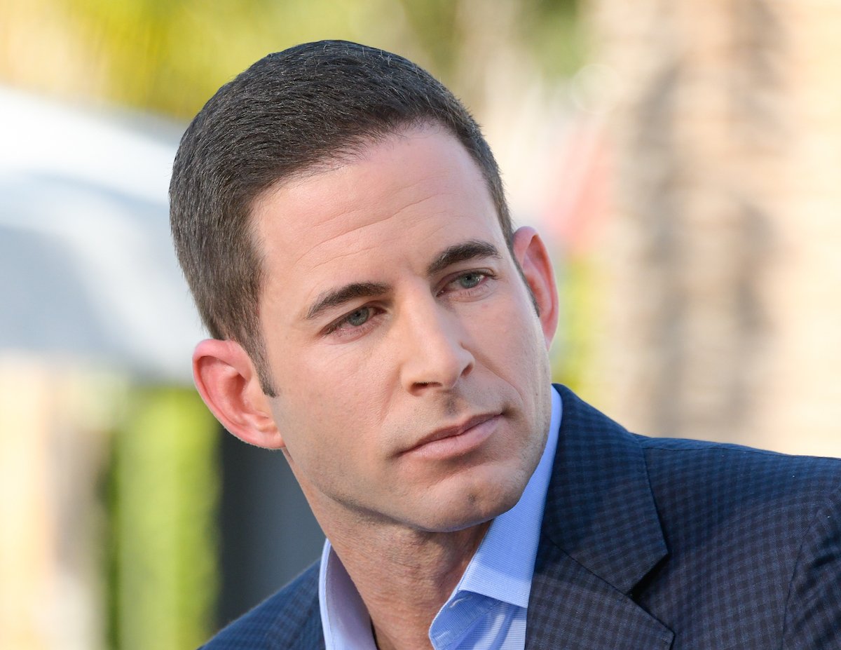 Tarek El Moussa gazes away from the camera.