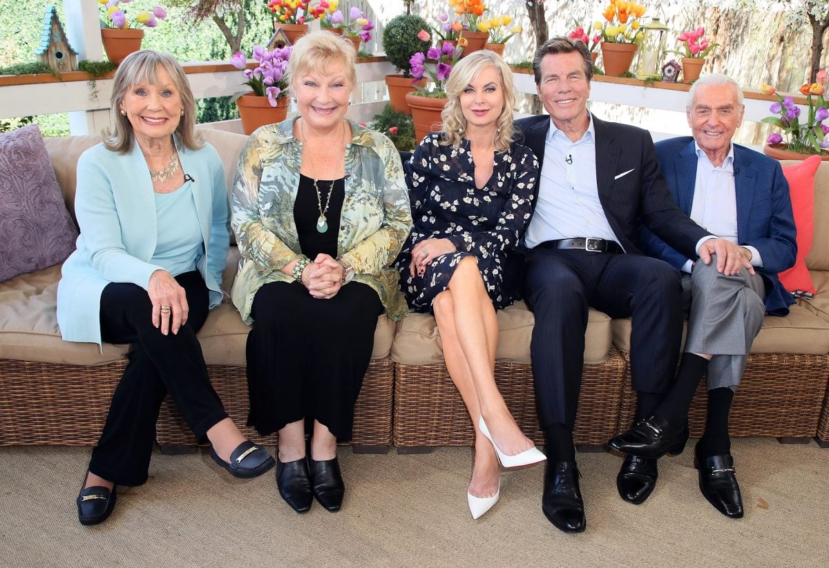 'The Young and the Restless' Abbott family cast members sitting on a couch.