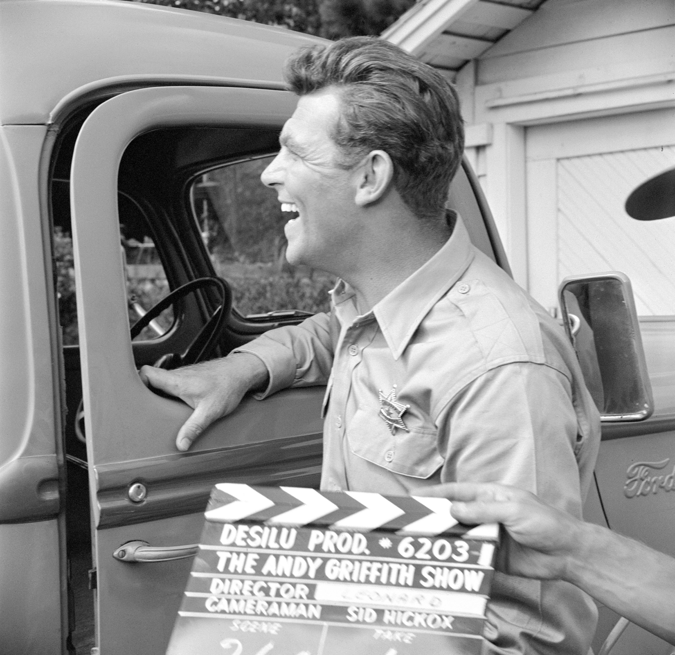 Actor Andy Griffith is photographed laughing while filming 'The Andy Griffith Show'