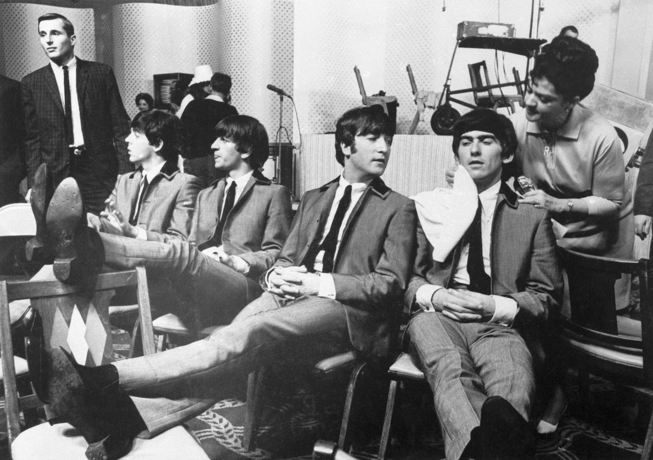 The Beatles having their faces wiped following a rehearsal in 1964.