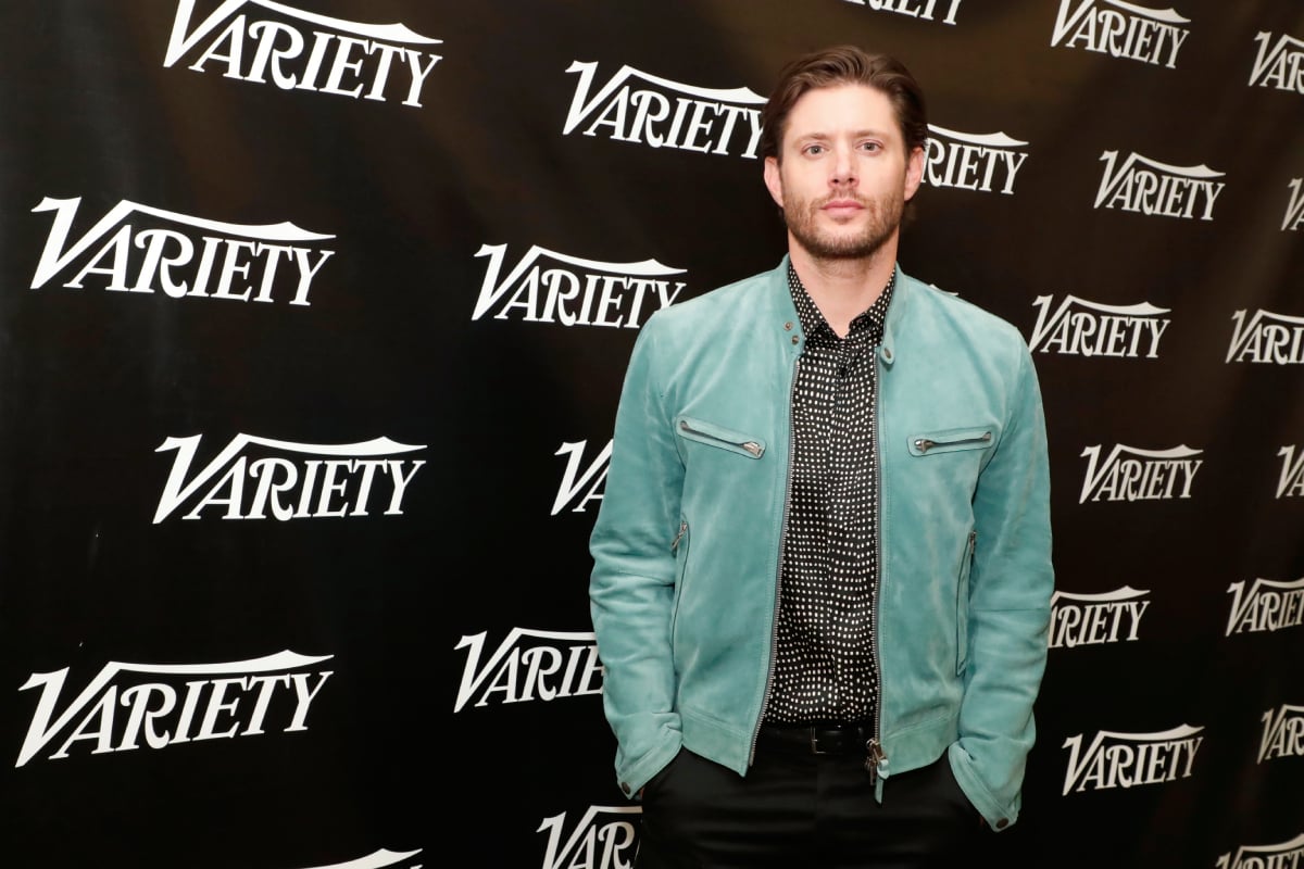 Jensen Ackles, from the series The Boys, poses at the Variety Studio wearing a blue jacket and black and white shirt. 