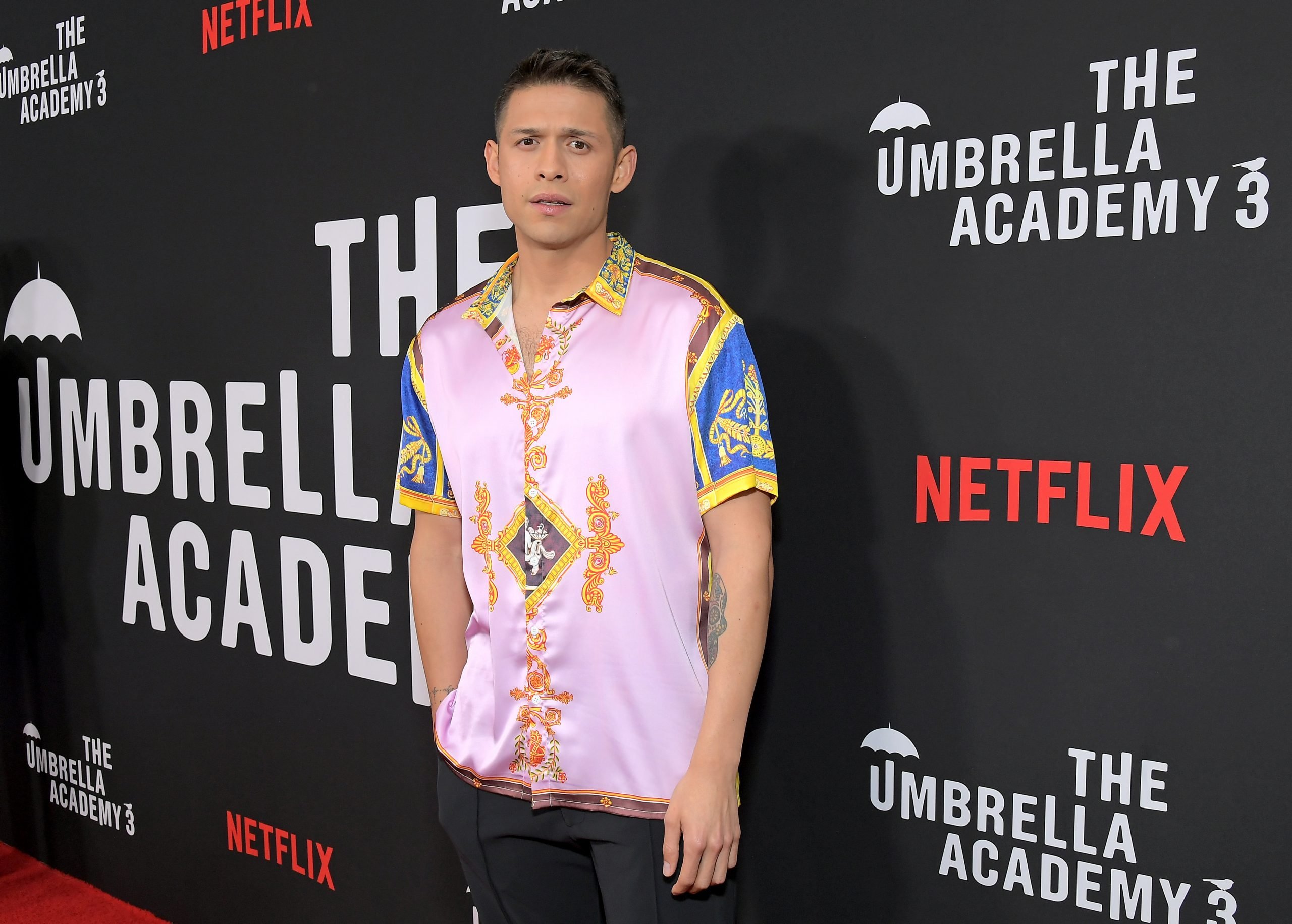 'The Umbrella Academy' Season 3 star David Castañeda at the series' season 3 premiere wearing a pink shirt.