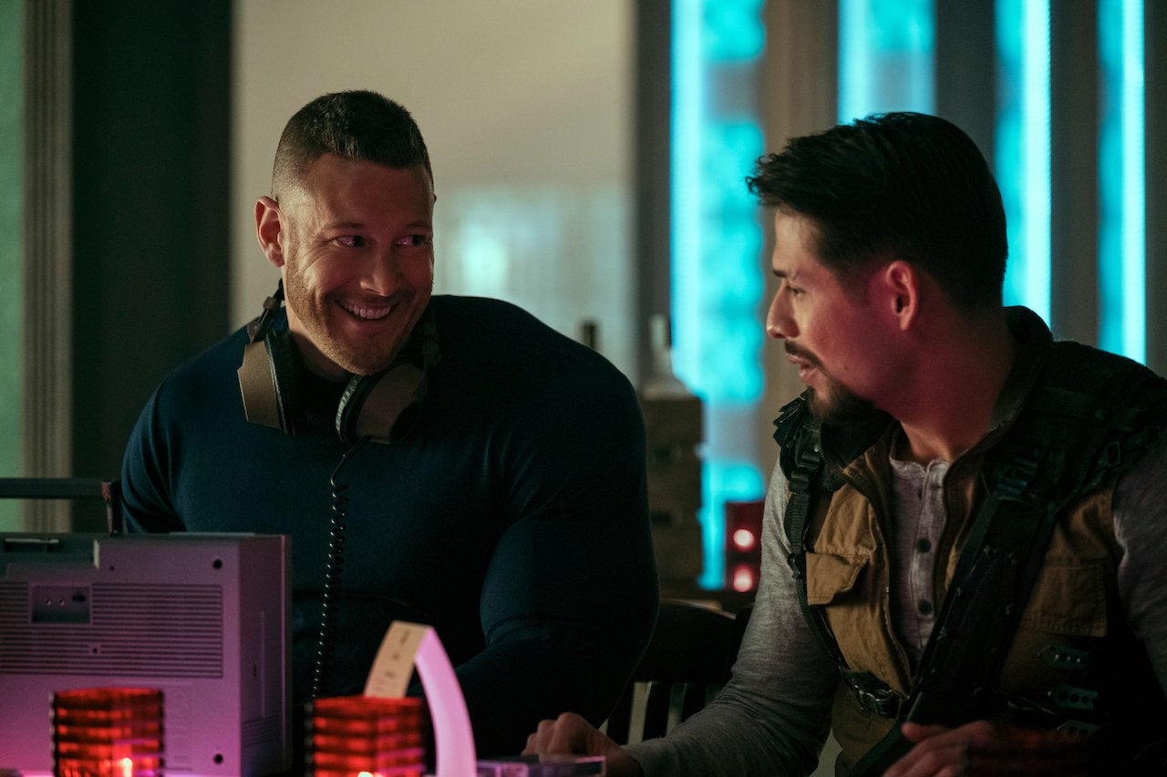 Tom Hopper as Luther Hargreeves sits with David Castañeda as Diego Hargreeves in 'The Umbrella Academy'.