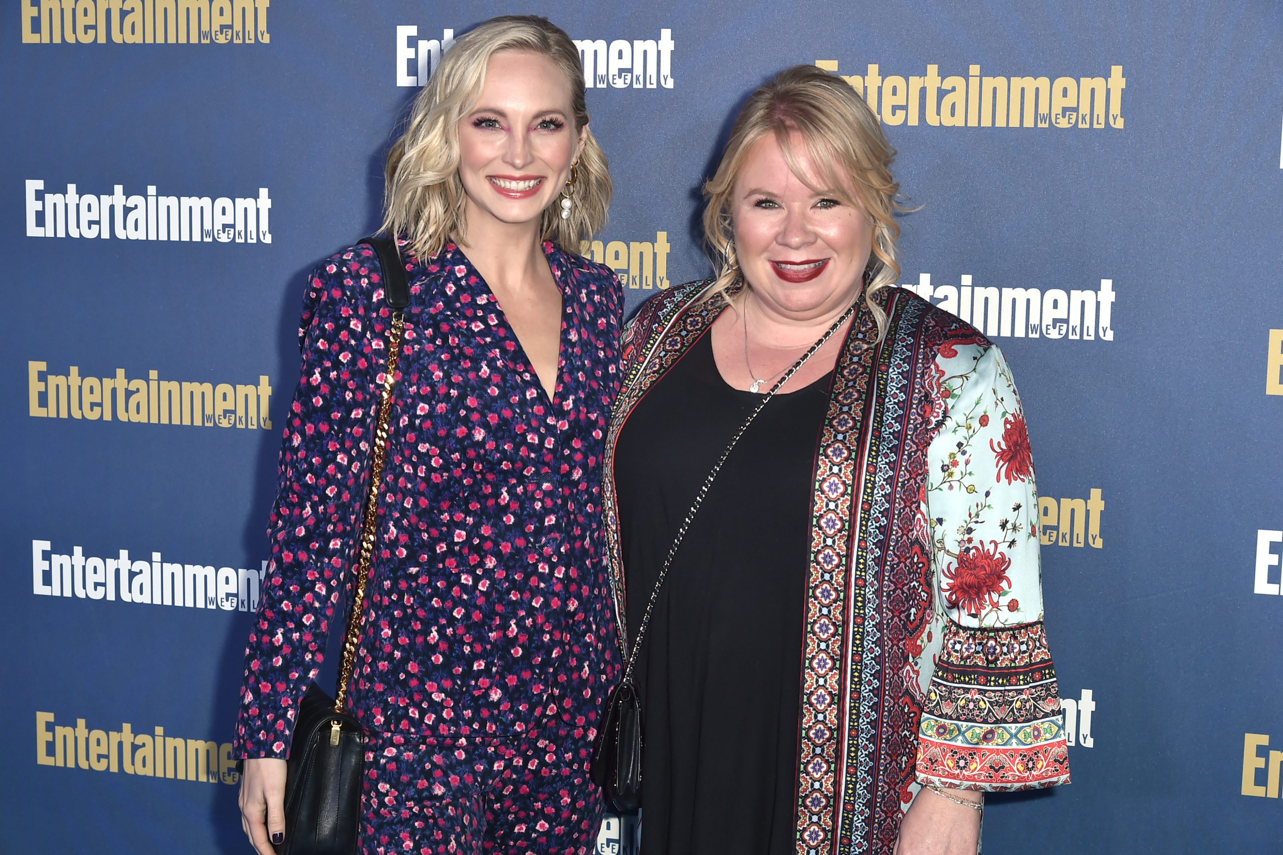 Candice King and Julie Plec, who has a 'The Vampire Diaries' spinoff in the works, pose for pictures on the red carpet.