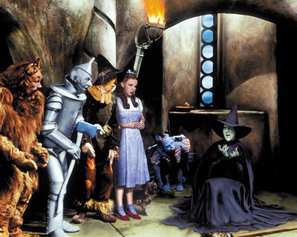 'The Wizard of Oz' characters - the cowardly lion, the tin man, the scarecrow, Dorothy, and Elvira in a scene from the film