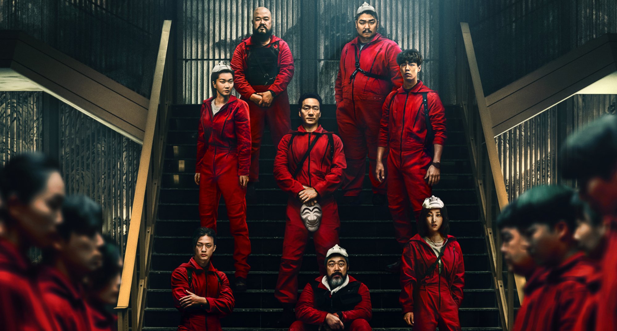 The main cast of 'Money Heist Korea - Joint Economic Area' K-drama wearing red jumpsuits.