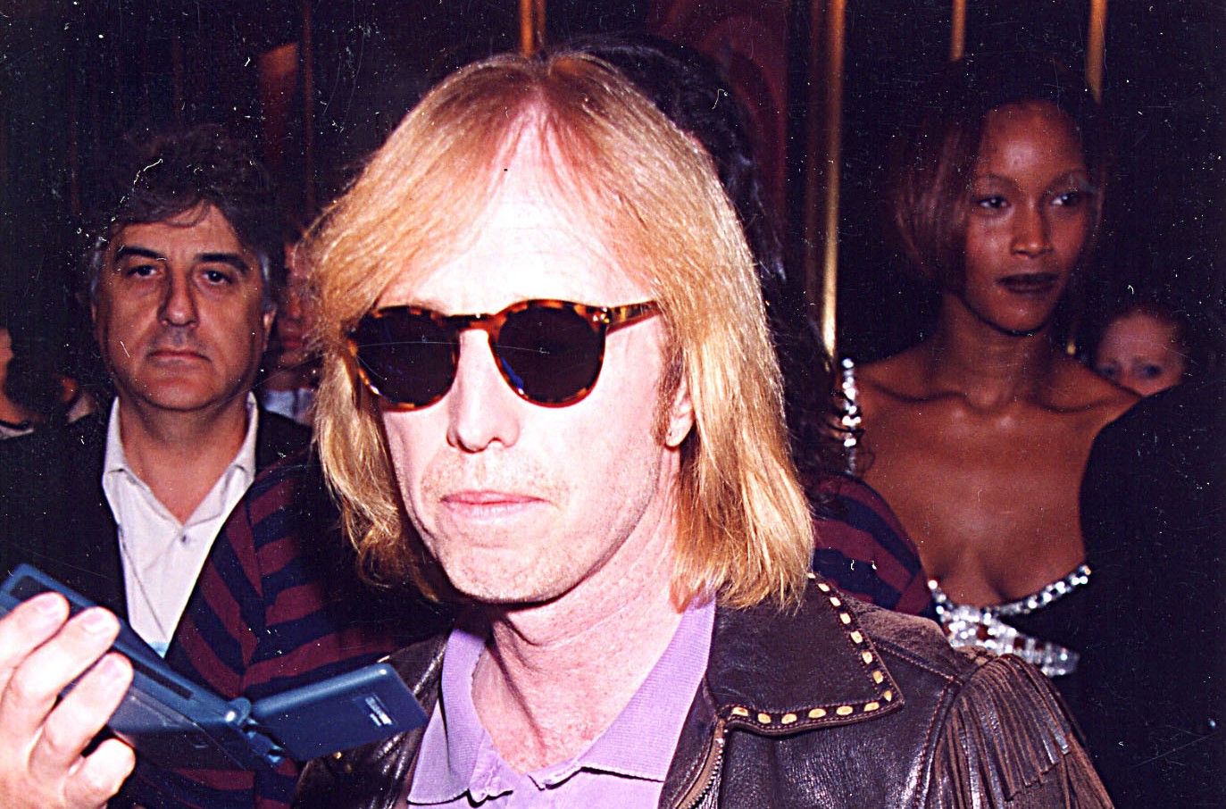 Tom Petty wears sunglasses and a leather jacket at the 1995 MTV Video Music Awards.