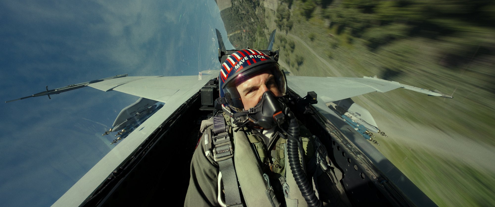 Tom Cruise as Maverick flying an aircraft in a scene from Top Gun: Maverick