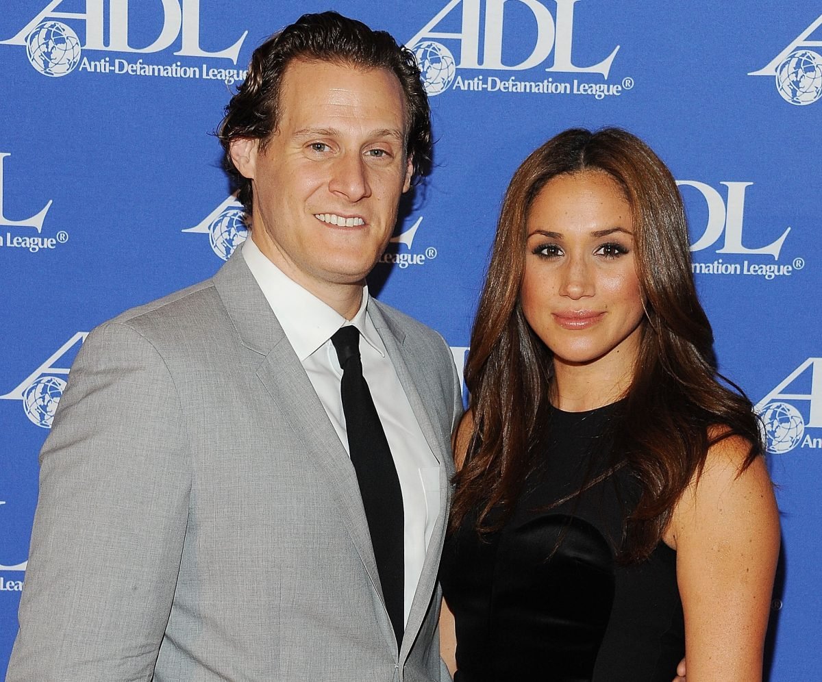Trevor Engelson and Meghan Markle pose together on the carpet at the Anti-Defamation League Entertainment Industry Awards.