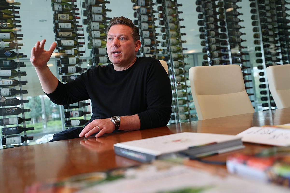 Celebrity chef Tyler Florence wears a dark sweater in this photograph.