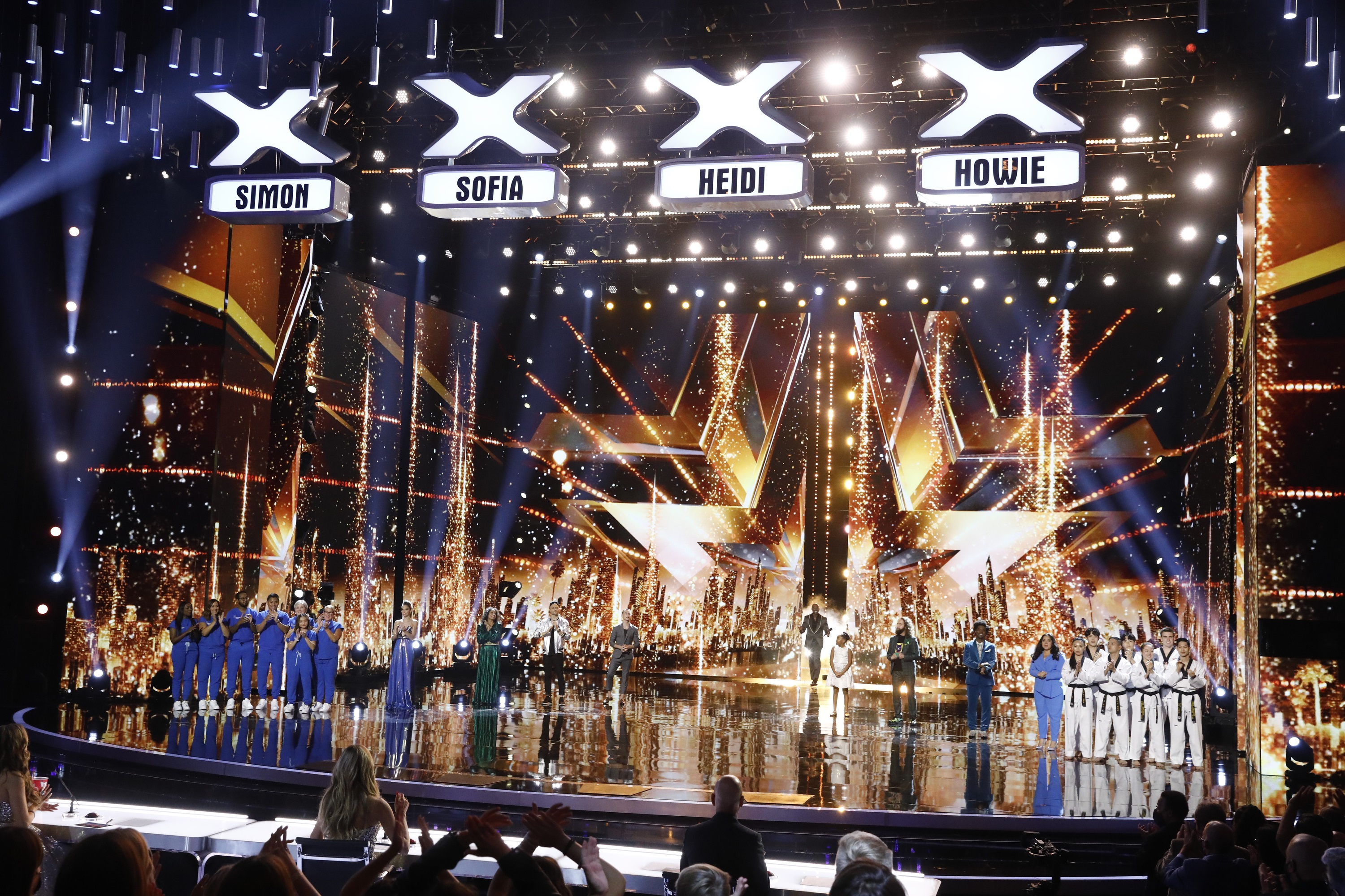 'AGT' Season 16 finalists standing together with the host: Northwell Nurse Choir, Lea Kyle, Brooke Simpson, Dustin Tavella, Aidan Bryant, Terry Crews, Victory Brinker, Josh Blue, Jimmie Herrod, Gina Brillon, World Taekwondo Demo Team