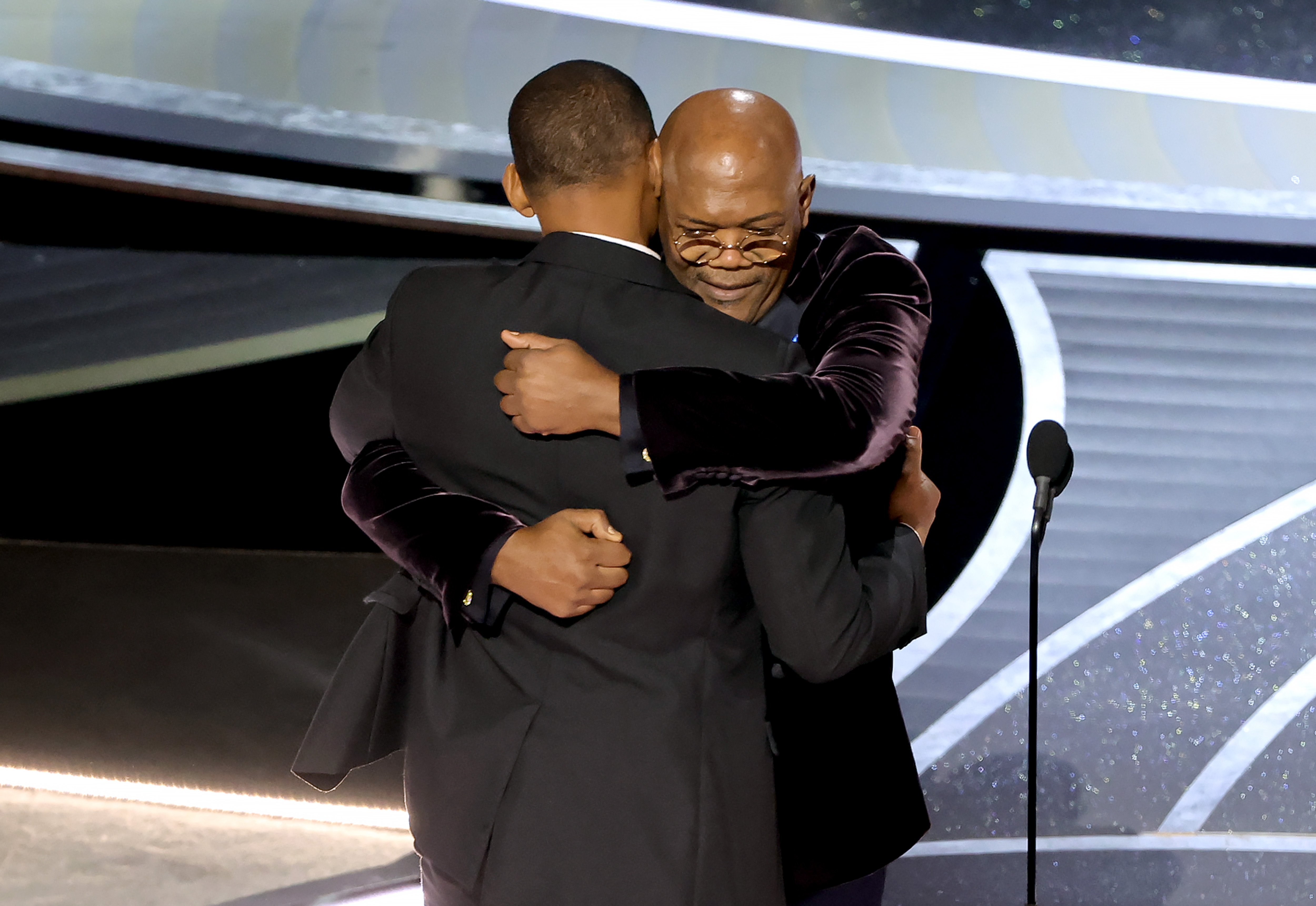 Will Smith accepts the Academy Award for Best Actor at the 2022 Oscars, given to him by Samuel L. Jackson