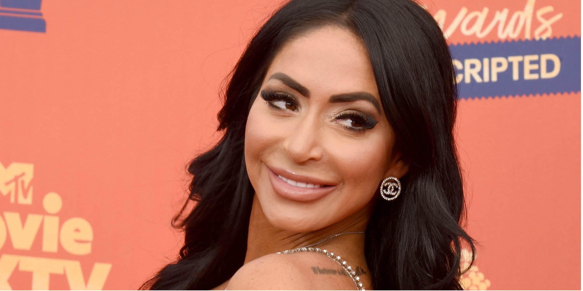 Angelina Pivarnick, star of 'Jersey Shore: Family Vacation' star on the red carpet at the MTV Movie Awards.