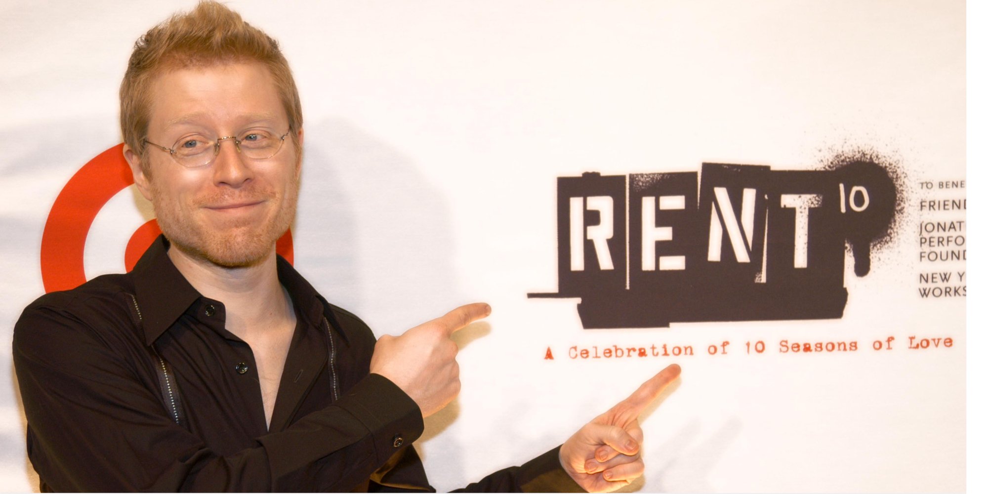 Anthony Rapp poses with the 10th anniversary sign for the Broadway play 'Rent.'