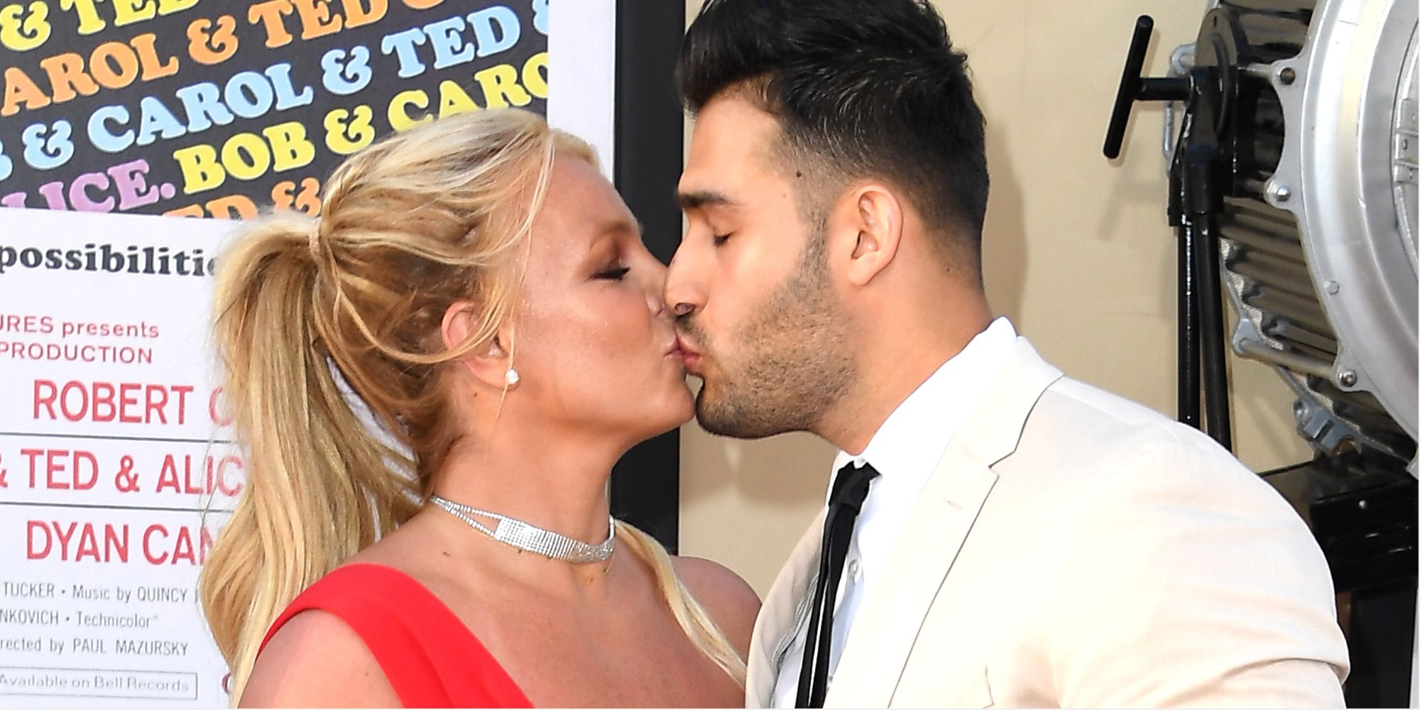 Britney Spears and Sam Asghari pose on the red carpet.