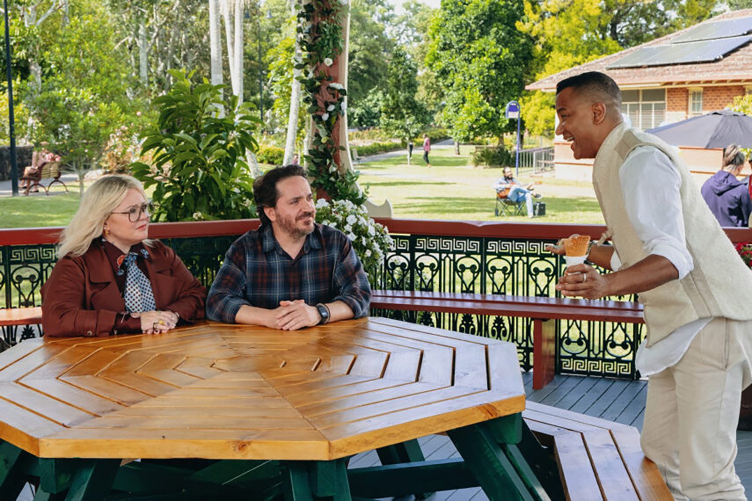 Melissa McCarthy as Amily, Ben Falcone as Clark, and Yanic Truesdale as Chamuel in God's Favorite Idiot.