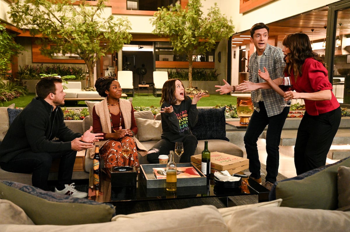 the ‘Home Economics’ cast gathers in an outdoor seating area in the season 2 finale, which will lead into season 3