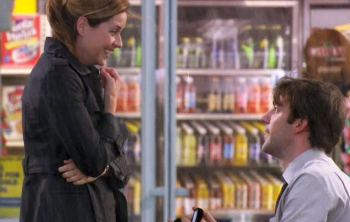 Pam (Jenna Fischer) smiles as Jim (John Krasinski) proposes to her in the 'The Office' Season 5 episode 'Weight Loss'