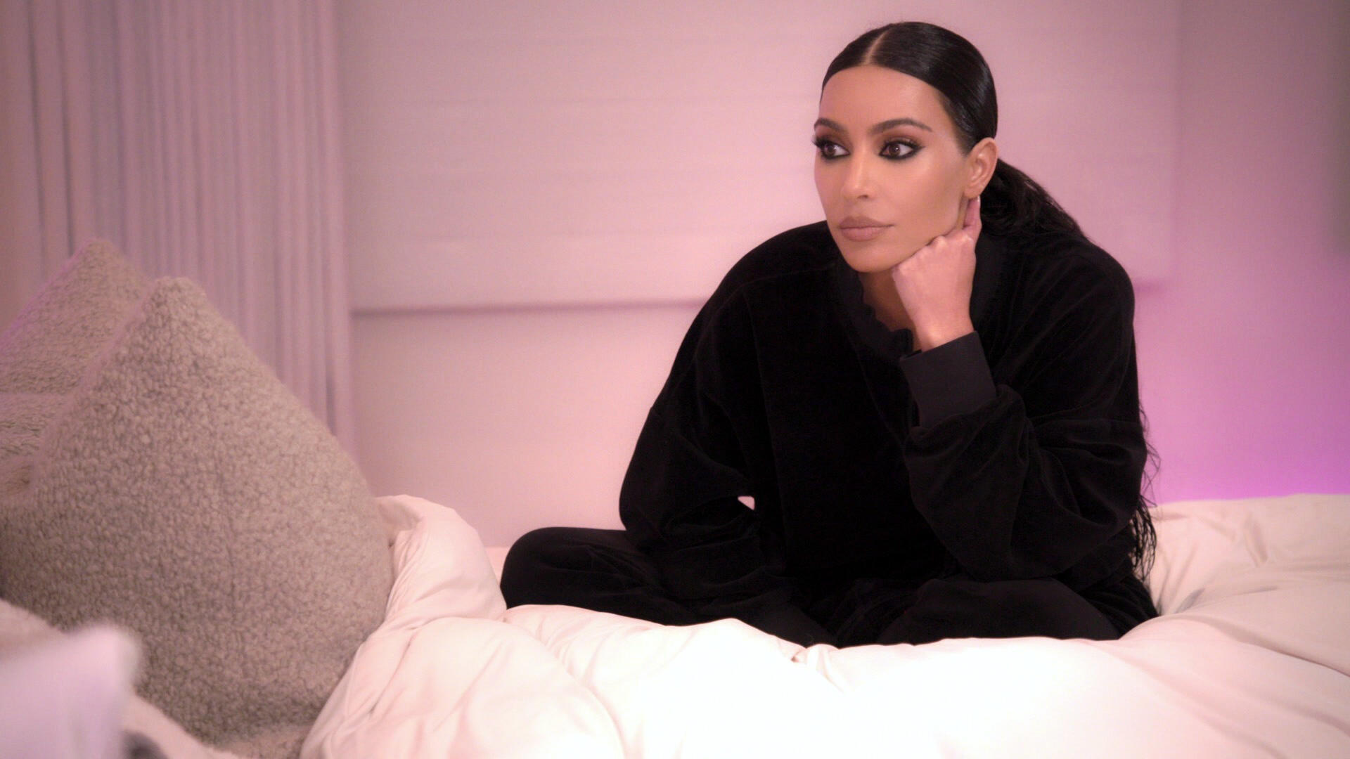 Kim Kardashian sits on Khloé's bed in 'Enough is Enough' episode of the Hulu series
