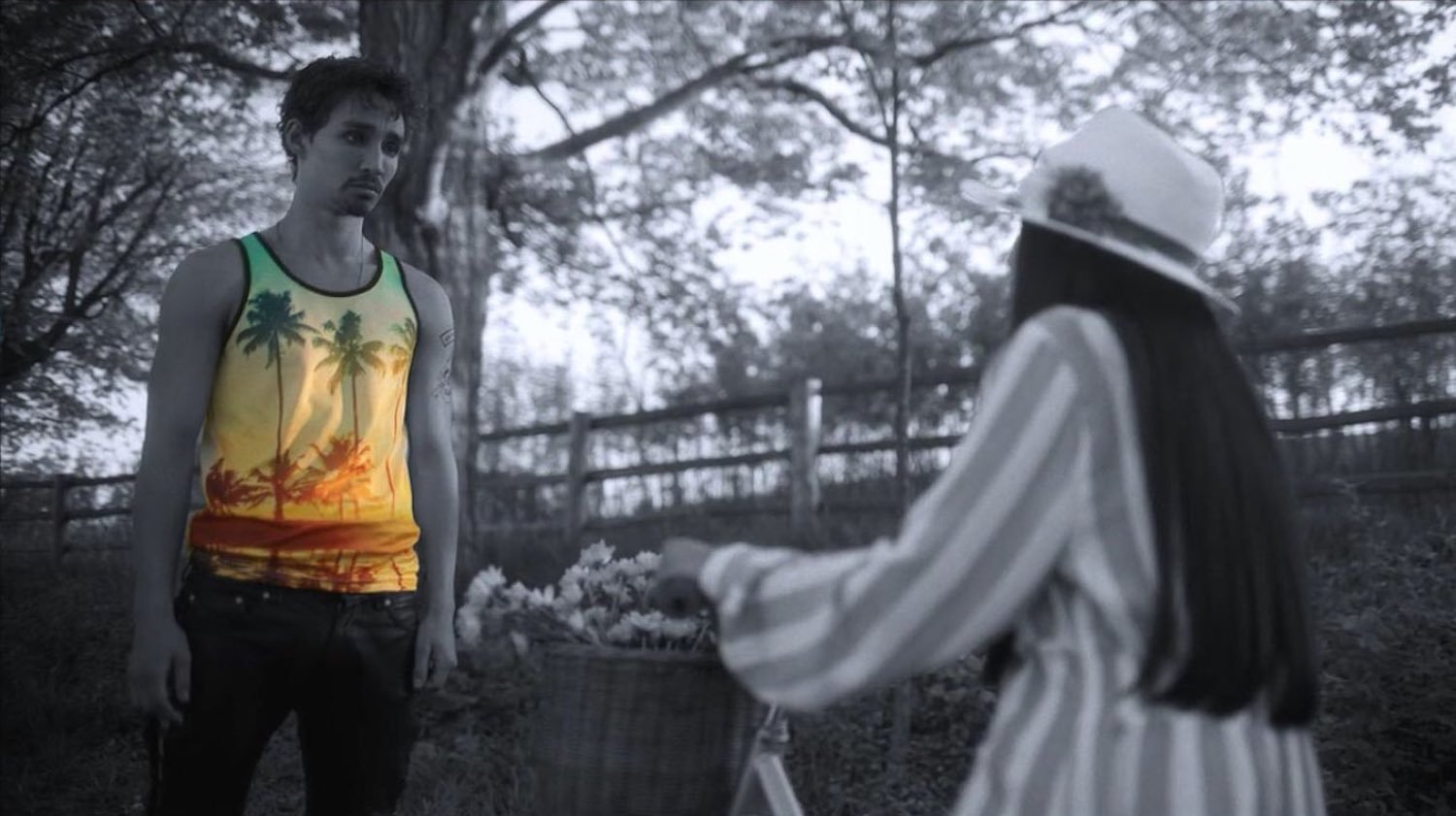 Klaus (Robert Sheehan) interacts with God () wearing a mostly yellow tank top in the first season of 'The Umbrella Academy'