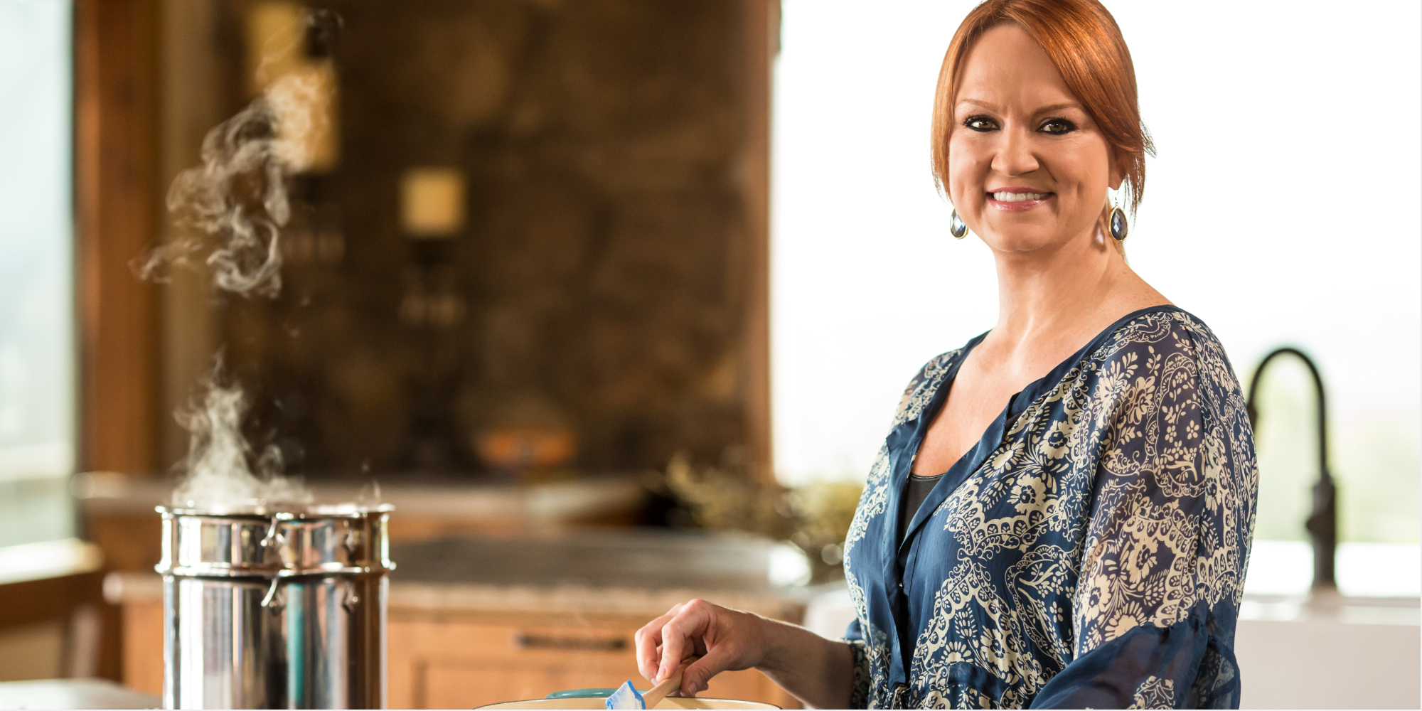 ree drummond wears a blue shirt and cooks on the set of 'The Pioneer Woman'