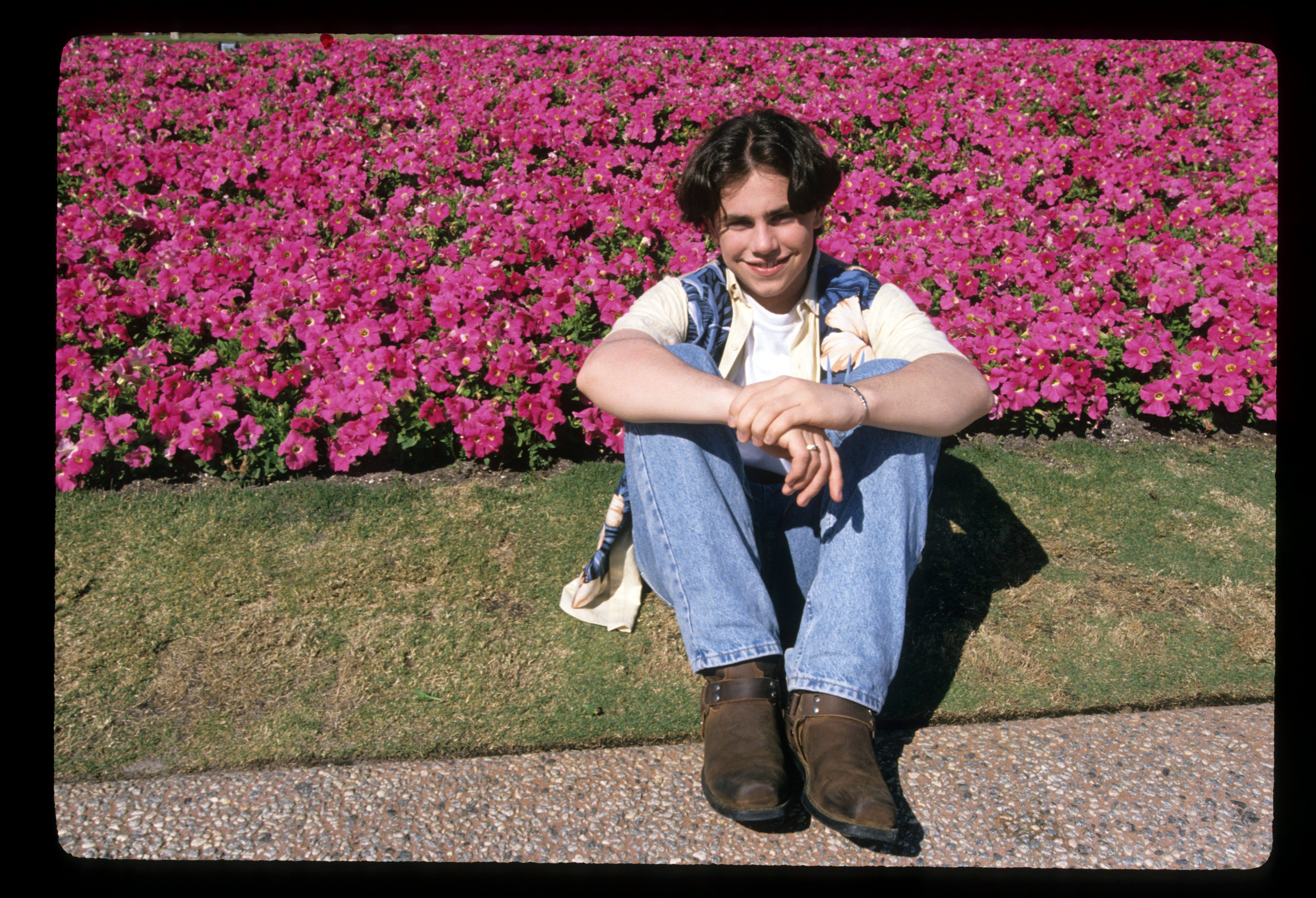 Rider Strong poses for a photo while filming an episode of 'Boy Meets World'